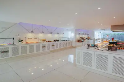 a store with white counters in a large room at Seasons Hotel (Adults Only) in Ayia Napa