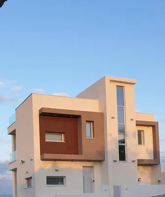 aominium building with a large window on top of it at Villa Chrystalleni in Protaras