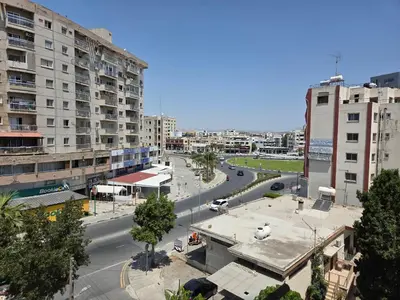 an aerial view of a city with buildings and a street at One Bedroom aptm Larnaca in Larnaka