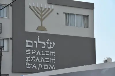 a building with a sign on the side of it at Rimon Cyprus Israeli Kosher Rooms in Larnaka