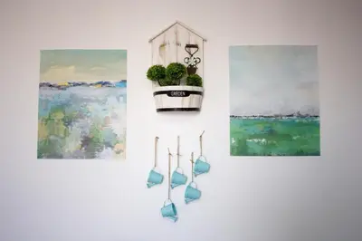 a hanging planter with a potted plant on a wall at Rimon Cyprus Israeli Kosher Rooms in Larnaka