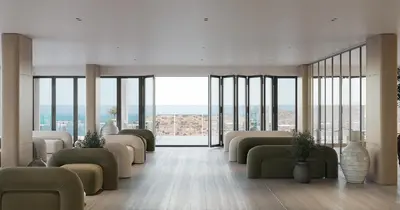 a waiting room with couches and tables and windows at Sun Palace Protaras Waterpark Resort in Protaras