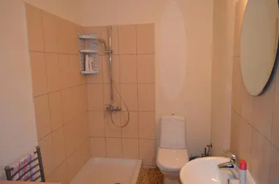 a bathroom with a shower and a toilet and a sink at Saint Nicholas heights in Chakistra