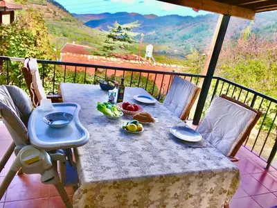 a table with food on top of a balcony at Saint Nicholas heights in Chakistra