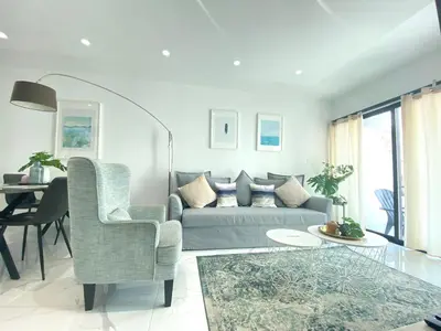 a living room with a couch and a table at Metro Court Apartments in Limassol