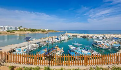 a bunch of boats docked in a harbor at Ayia Triada View in Protaras