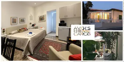 a kitchen and a living room with a table in a room at Avgi's Home in Limassol