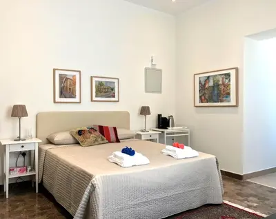 a bedroom with a bed with towels on it at Avgi's Home in Limassol