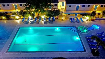 an overhead view of a swimming pool at night at Green Bungalows Hotel Apartments in Ayia Napa