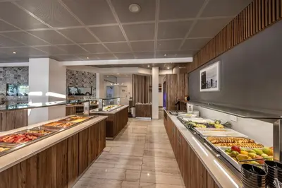 a buffet line with many different types of food at Lantiana Gardens ApartHotel in Protaras