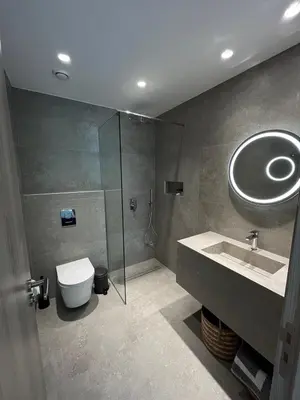 a bathroom with a sink and a toilet and a shower at Abacus Suites in Ayia Napa