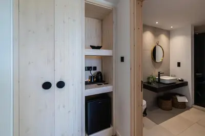 a bathroom with a sink and a toilet in a room at Abacus Suites in Ayia Napa