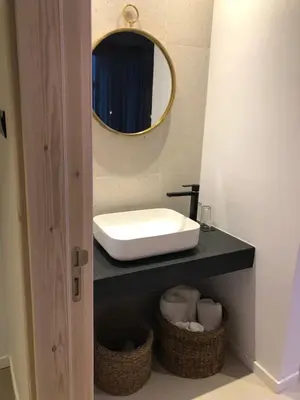 a bathroom with a sink and a mirror at Abacus Suites in Ayia Napa