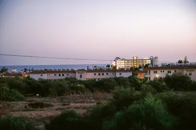a view of a city at sunset at Villa Costa Cornelia Homes in Ayia Napa