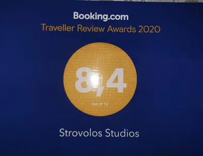 a gold circle with the number eight on it at Strovolos rooms Studios in Nicosia