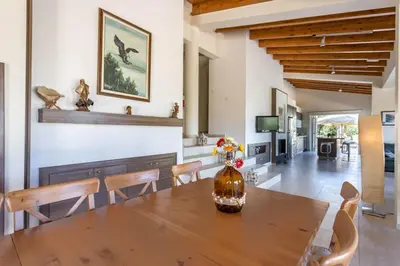 a dining room with a wooden table and chairs at Marina Estate in Protaras