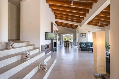 a living room with a couch and a tv at Marina Estate in Protaras
