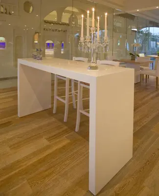 a white island in the middle of a room at Sandy Beach Hotel & Spa - ex Sentido in Larnaka