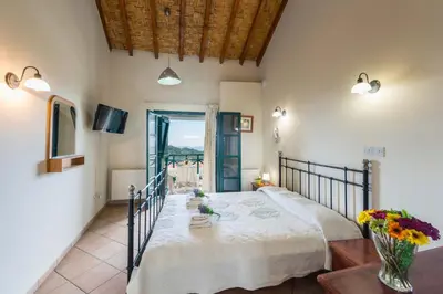 a bedroom with a large bed in a room at Themis House in Lemithou