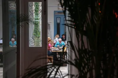 a group of people sitting at a table at S Paul City Hotel in Limassol