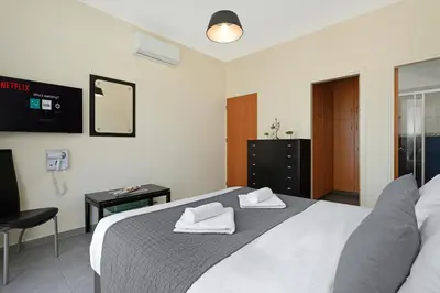 a bedroom with a bed with two towels on it at Villa Venus in Protaras