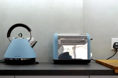 a toaster and a tea kettle on a kitchen counter at City Rendezvous One Bedroom Flat in Larnaka