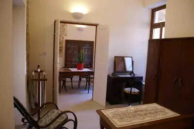 a living room with a table and a dining room at Yiayia's House Limassol city in Limassol