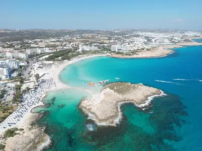 an aerial view of a beach and the ocean at Aktea Beach Village in Ayia Napa