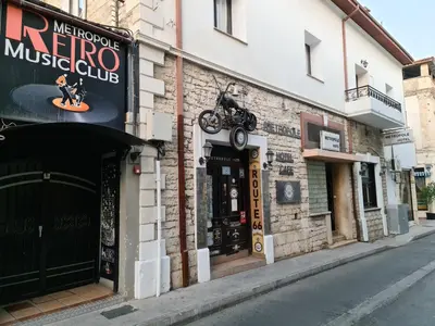a building with a sign for a motorcycle club at Metropole Hotel in Limassol