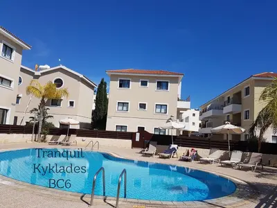 a swimming pool in front of some apartment buildings at Tranquil Kyklades BC6, WALK to BEACH in Paralimni