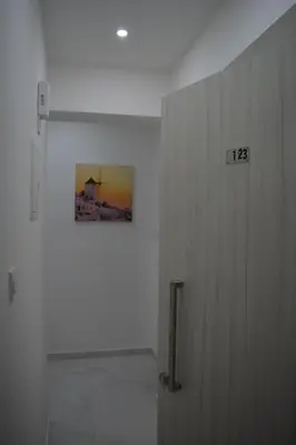 a door in a room with a picture on the wall at P.L Hermes Studios & Apartments in Larnaka