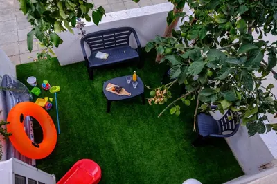 an overhead view of a garden with a table and chairs at FatCow Beach House 43 in Larnaka