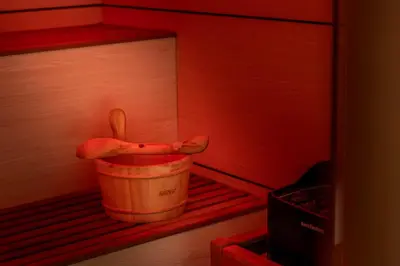 a wooden bucket with a pair of shoes in a room at Park Beach Hotel in Limassol