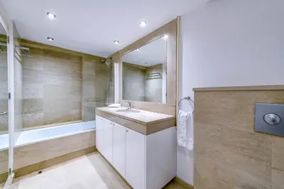 a bathroom with a sink and a tub at Villa Nausica in Protaras