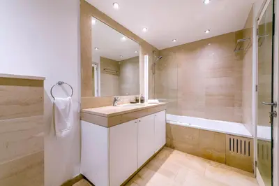 a bathroom with a sink and a tub at Villa Nausica in Protaras