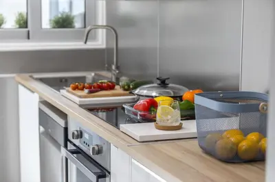 a kitchen with a counter with fruits and vegetables at Mackenzie Zoe Seafront Suite in Larnaka