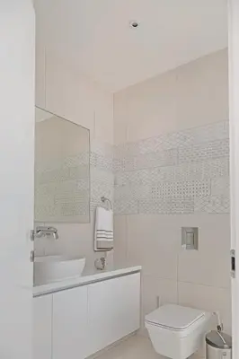 a white bathroom with a sink and a toilet at Seaview Luxury Villa Jacuzzi & Pool! 2 Min Beach in Protaras