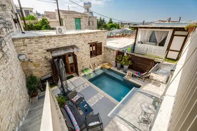 an overhead view of a swimming pool in a house at RedBlue Door Two Traditional Listed Houses in Pano Lefkara