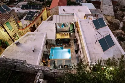 an aerial view of a house with a swimming pool at RedBlue Door Two Traditional Listed Houses in Pano Lefkara