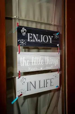a sign that says enjoy the little things in life at RedBlue Door Two Traditional Listed Houses in Pano Lefkara