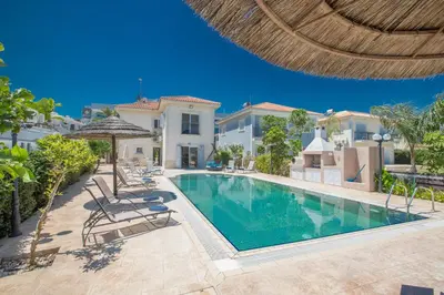 an image of a swimming pool in a villa at Jason Villas in Protaras