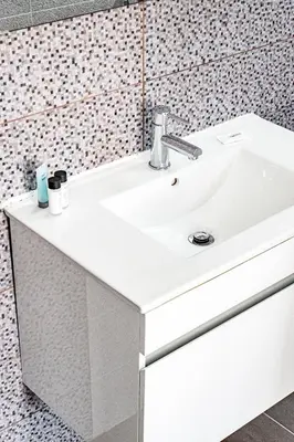 a bathroom with a white sink in a room at Beach Front Aqua Marina by Ezoria Villas in Paralimni