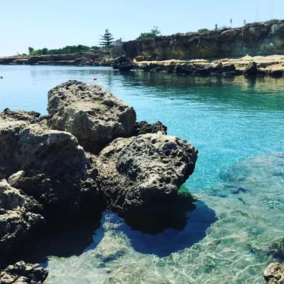 a body of water with rocks in the water at Palma Villa 14 in Protaras