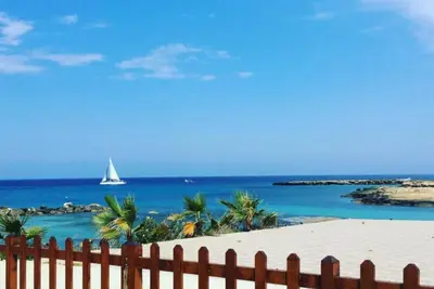 a sail boat in the ocean with a fence at Palma Villa 14 in Protaras