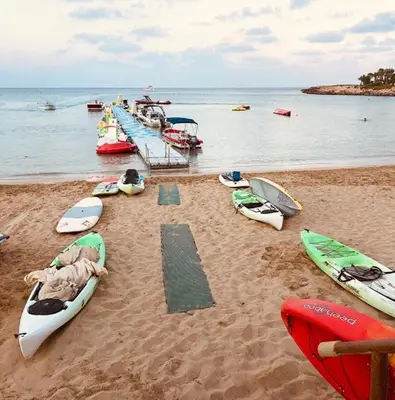 a group of kayaks sitting on the beach at Palma Villa 14 in Protaras