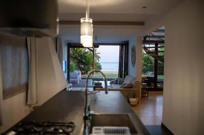 a kitchen with a view of the ocean from the living room at Balinese in Ayia Napa