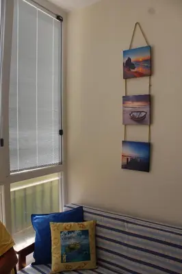 a living room with a couch and a window at Montehugh in Larnaka