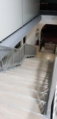 an empty staircase in a building with a potted plant at Sunny Napa Apartments in Ayia Napa