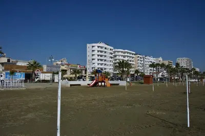 a park with a playground in the middle of a city at Kolonaki Seaview Apartments in Larnaka