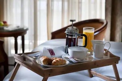 a tray of breakfast food and coffee on a table at Semeli Hotel in Nicosia